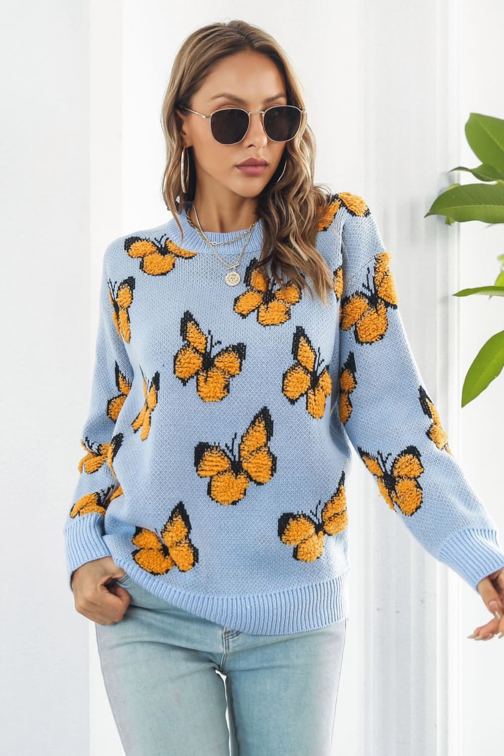 TrendiStyles Butterfly Pattern Round Neck Dropped Shoulder Sweater 🦋